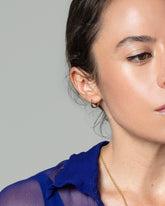 Madrone Flower Bud Hoop Earrings on model.