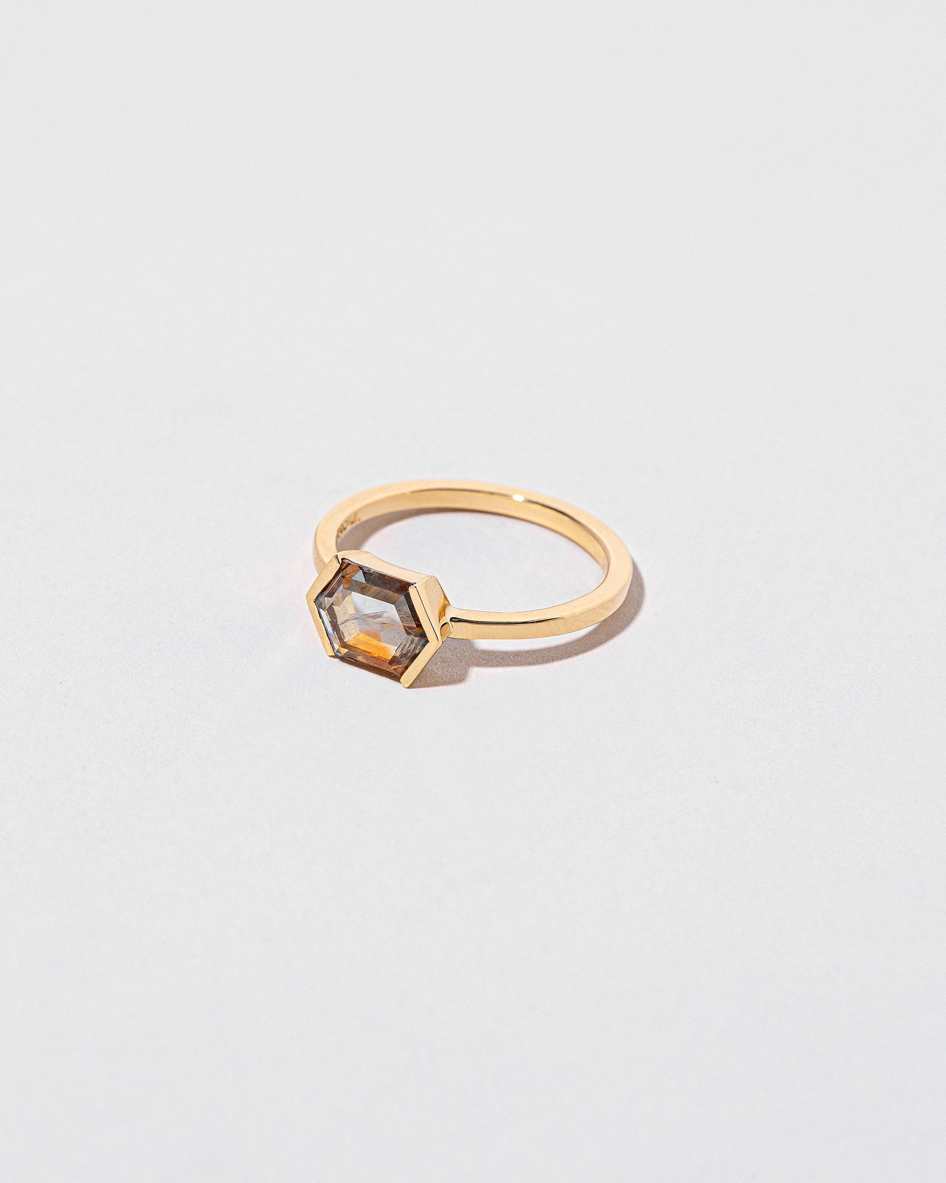 View from the side of the Amber Ring on light color background.