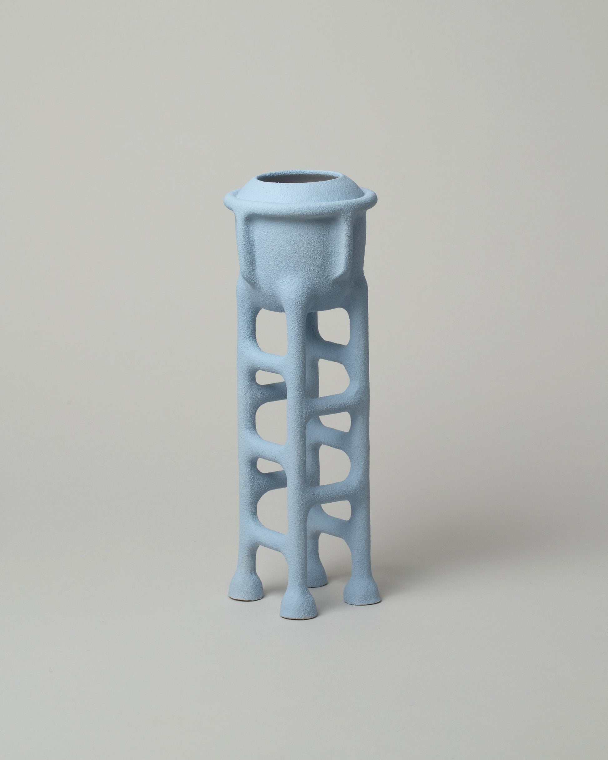  Solenne Belloir Pale Blue Water Tower on light color background.