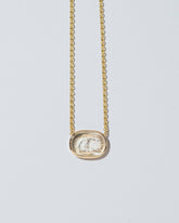  Simplicity Intaglio Seal Necklace on light color background.
