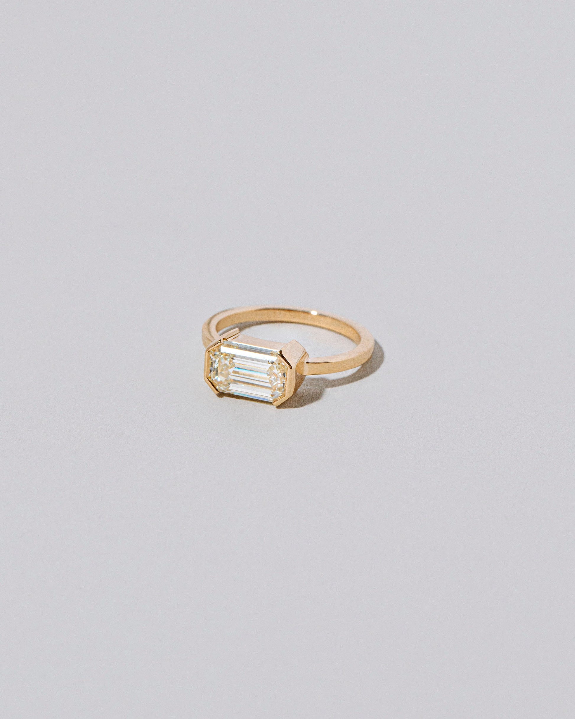 View from the side of the Two of Hearts Ring on light color background.