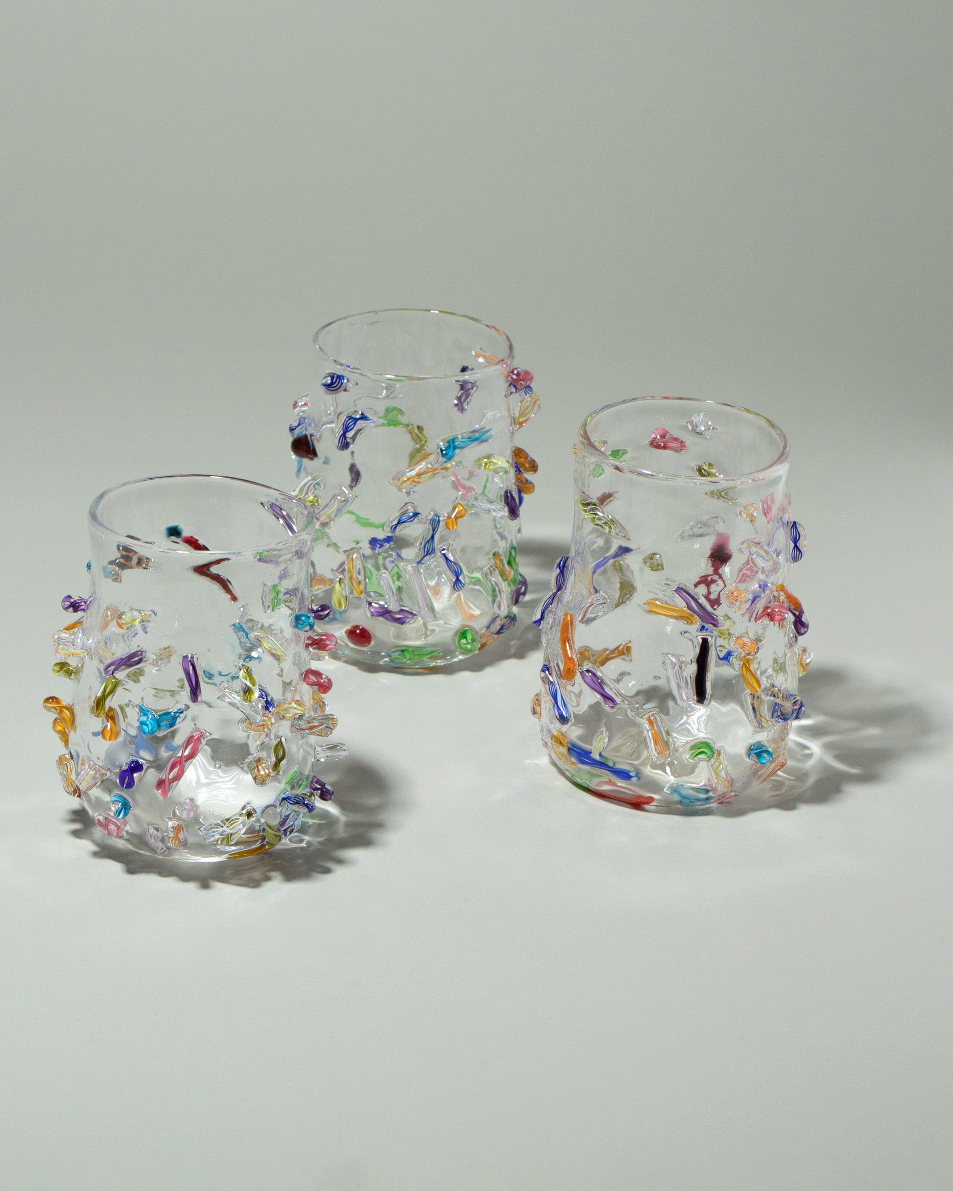 Stover Glass Cane Cups on light color background.