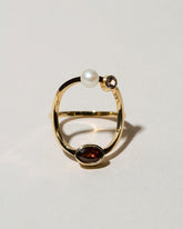  Trilogy Ring - Garnet on light color background.