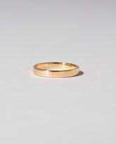 Gold 4mm Square Wire Band on light color background.