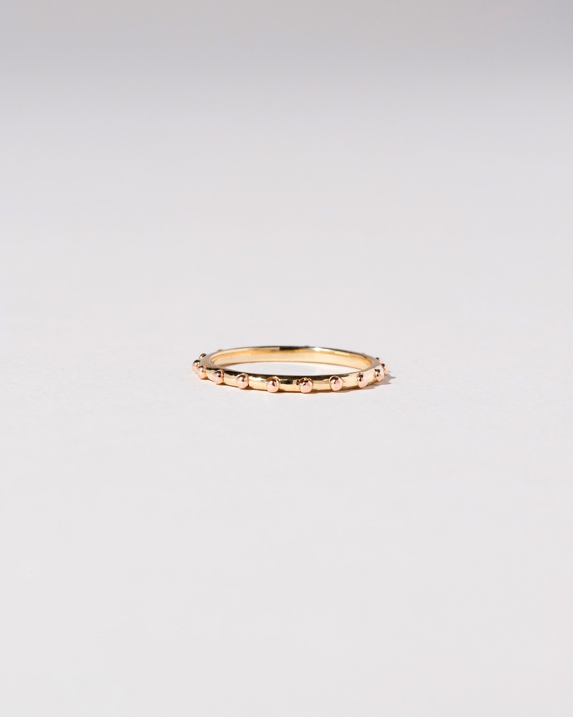 Gold Abacus Band on light color background.