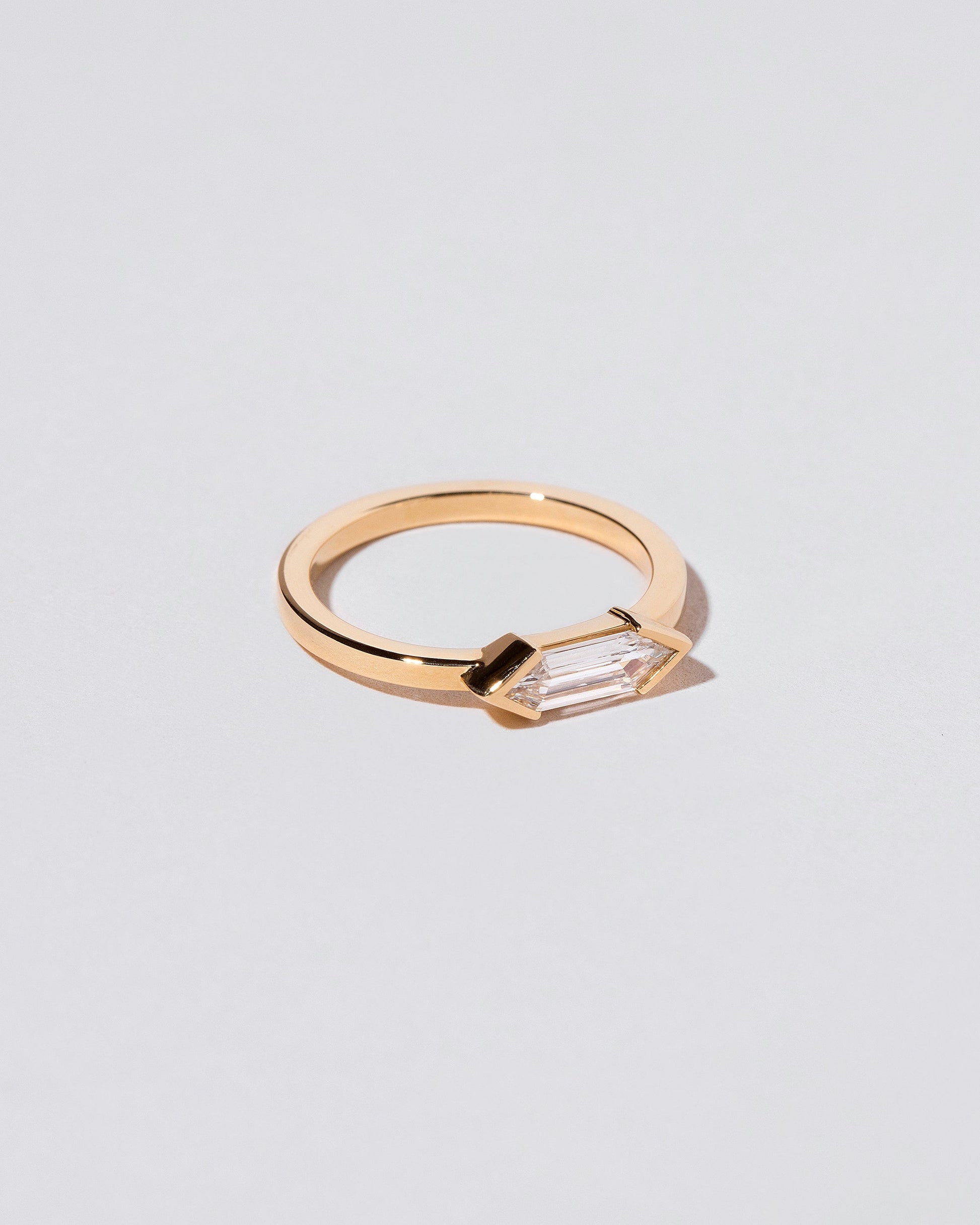 View from the side of the Paradise Ring on light color background.