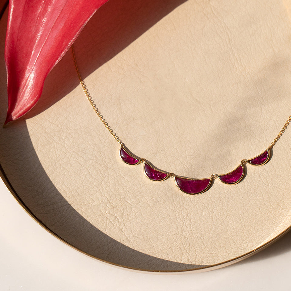 product_details::Styled image of the Invincibility Necklace.