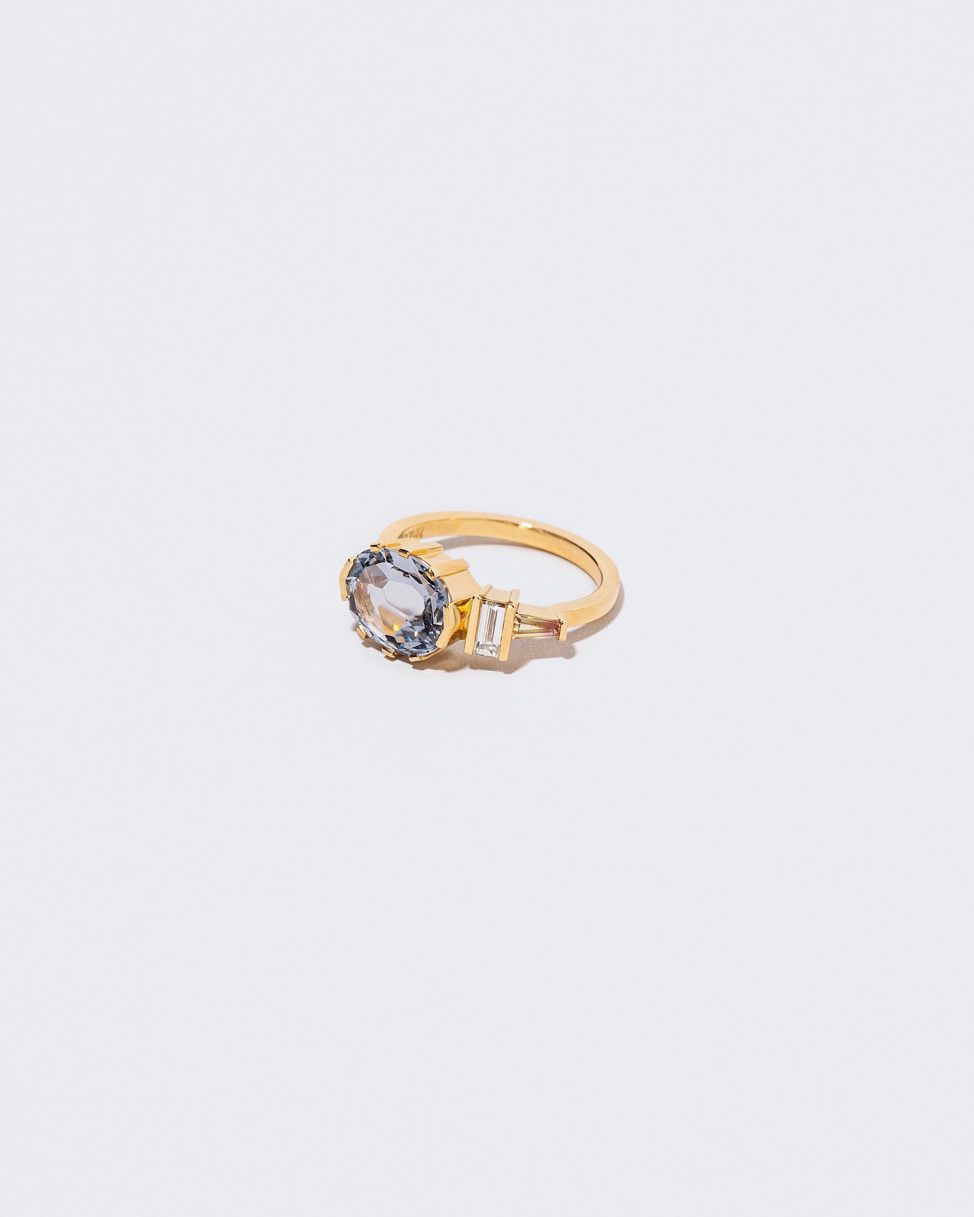 Side view of Heliotrope Ring on white background