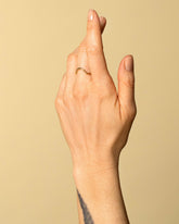 Gold Solid Round Wire Curve Band on model.