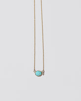 Rain Necklace on light color background.