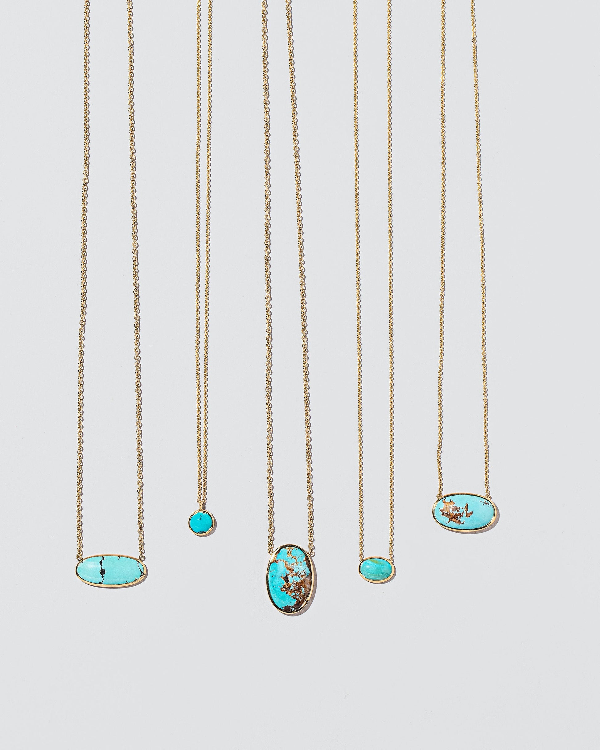 Group of Turquoise Necklaces on light colored background.