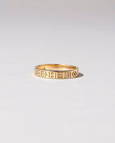 Gold Infinity Etched Band on light color background.