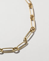 Closeup details of the Pavé Link Necklace on light color background.