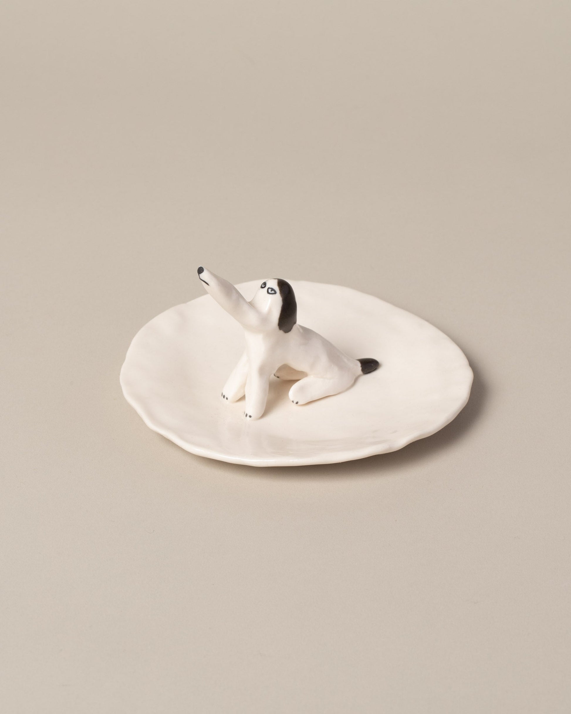 Closeup detail of the Eleonor Boström Dog Ring Dish on light color background.