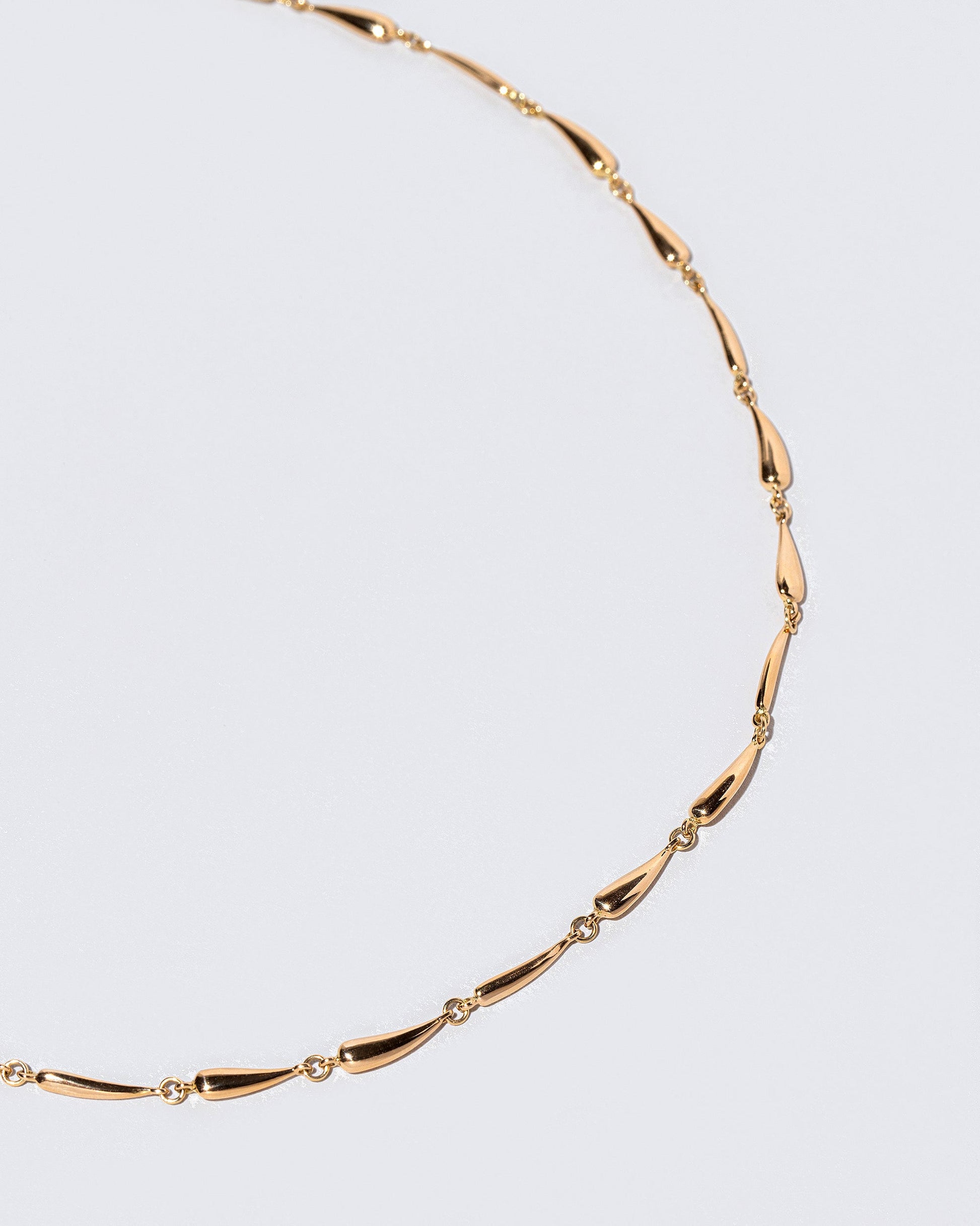  Accumulation Necklace on light color background.