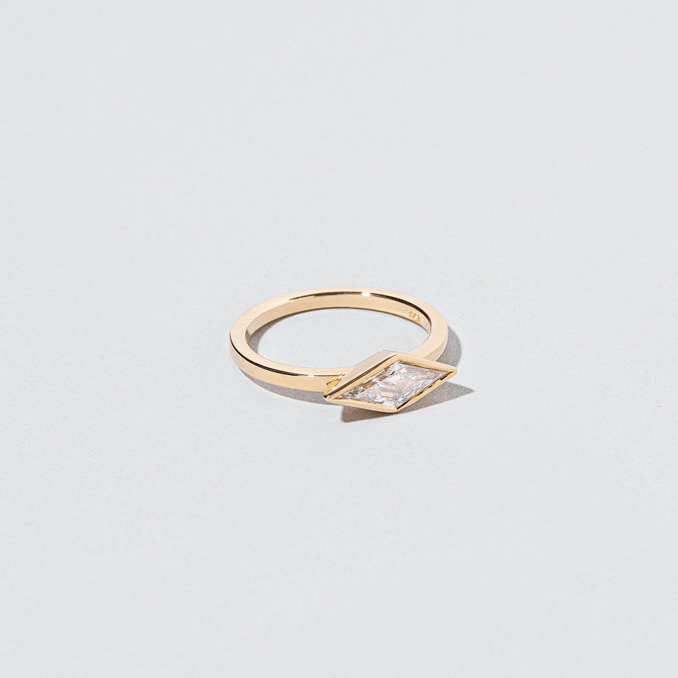 product_details::Closeup details of the Atomism Ring on light color background.