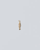 Pavé Fish Charm on light color background.