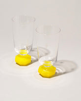 Closeup view the Reflections Copenhagen Neon Yellow Chelsea Glass Sets on light color background.