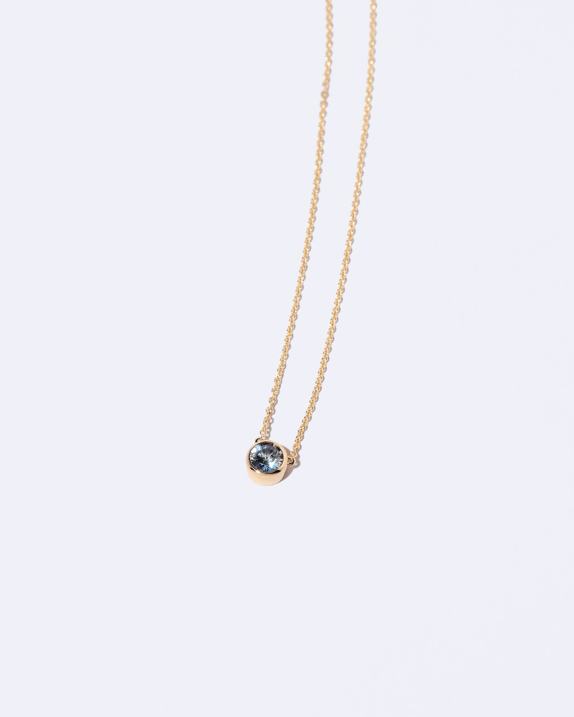  Razor Necklace on light color background.