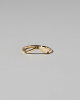 Gold Three Stone Black Diamond High Peak Band on light color background.