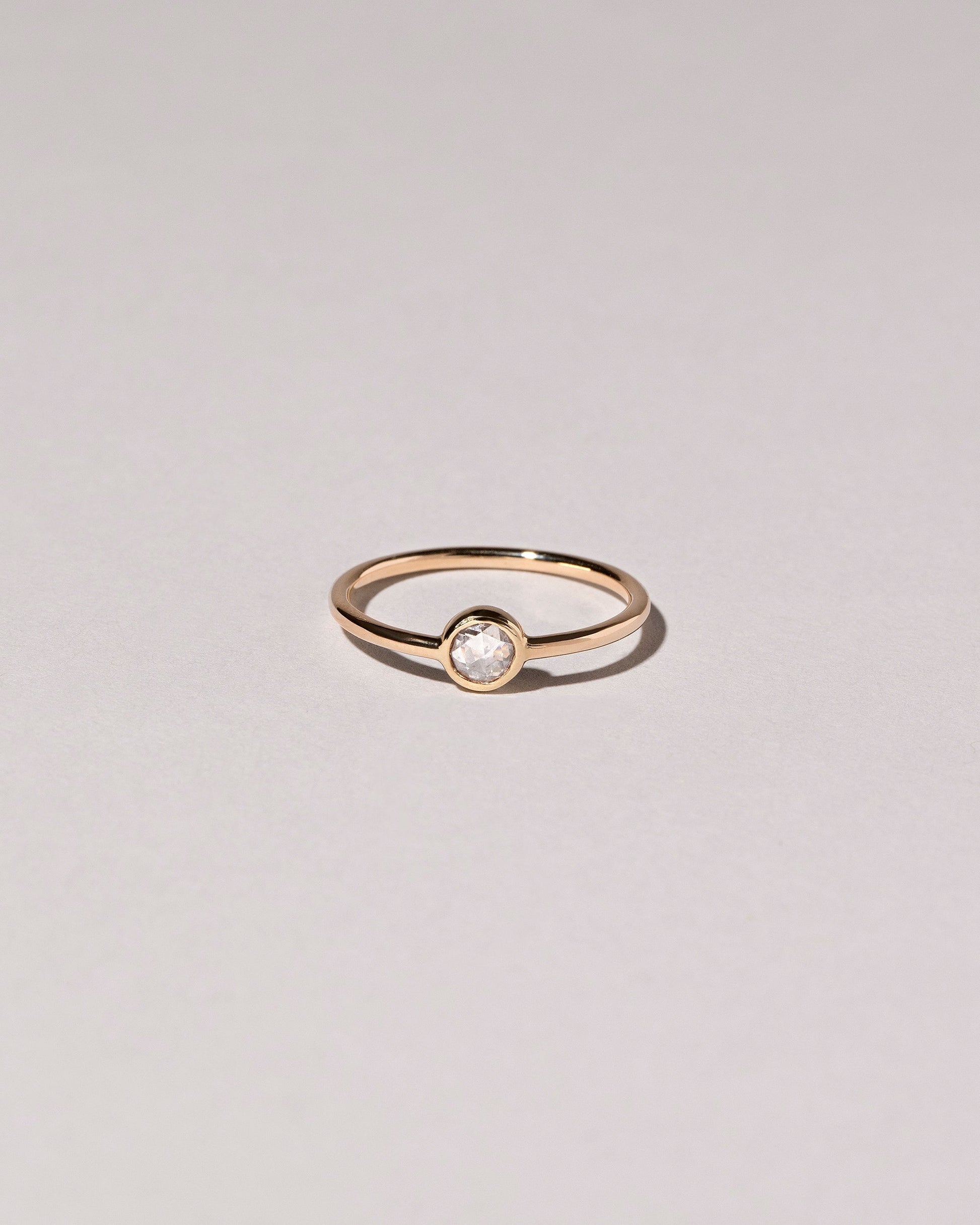 Rose Cut Purple Diamond Ring on light color background.