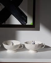 Styled image featuring the Eleonor Boström Default Title and Blue Spots Dog Cup Cat Tea Cup with Saucer and Dog Tea Cup & Saucers.