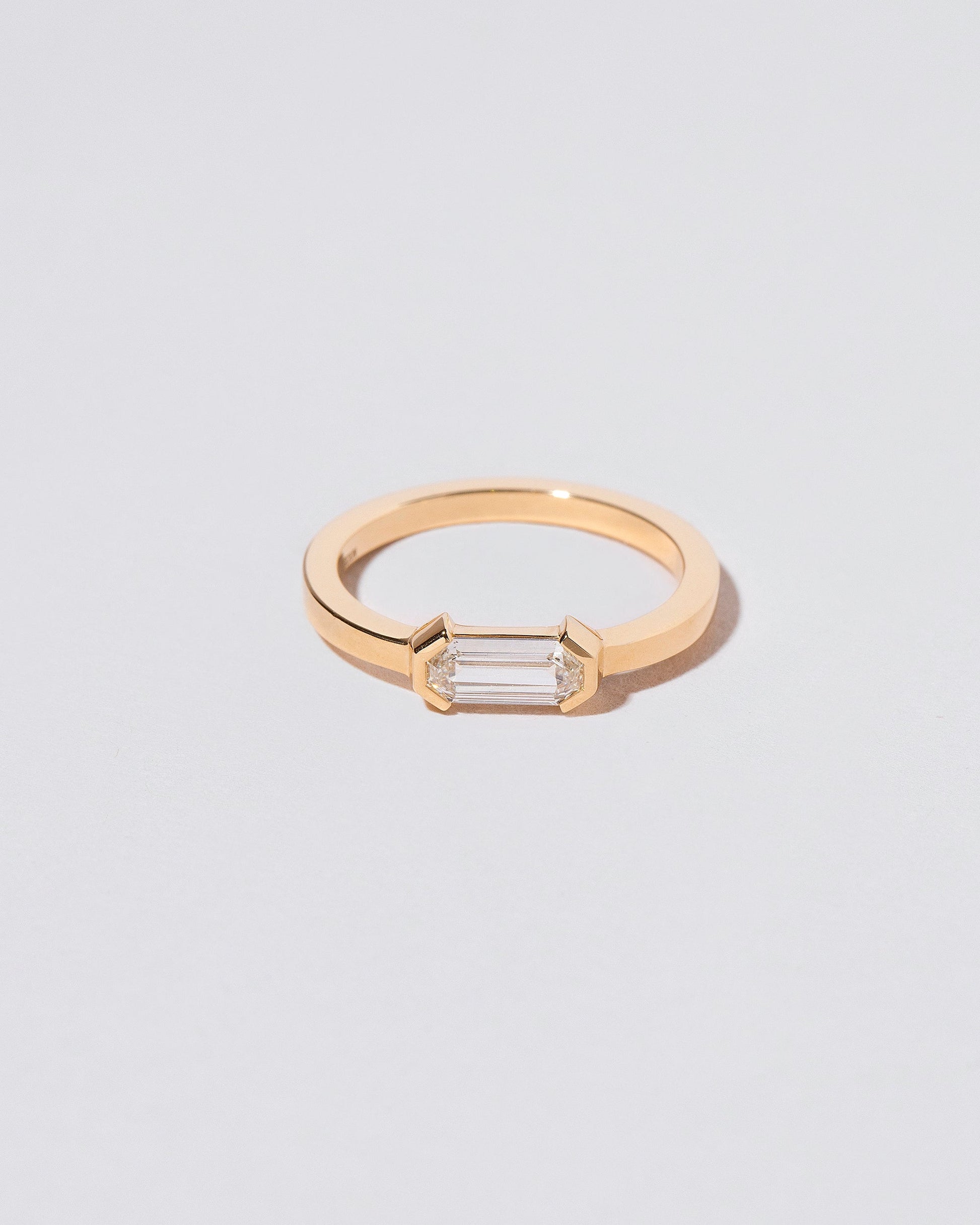 Alcon Ring on light color background.