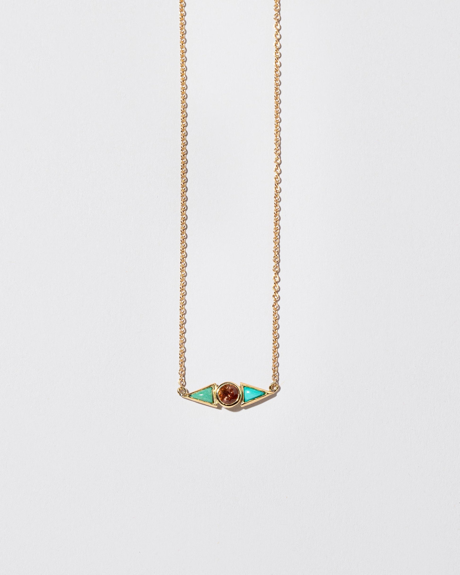  Sunstone & Turquoise Eye Necklace on light color background.