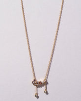  Anthea Necklace on light color background.