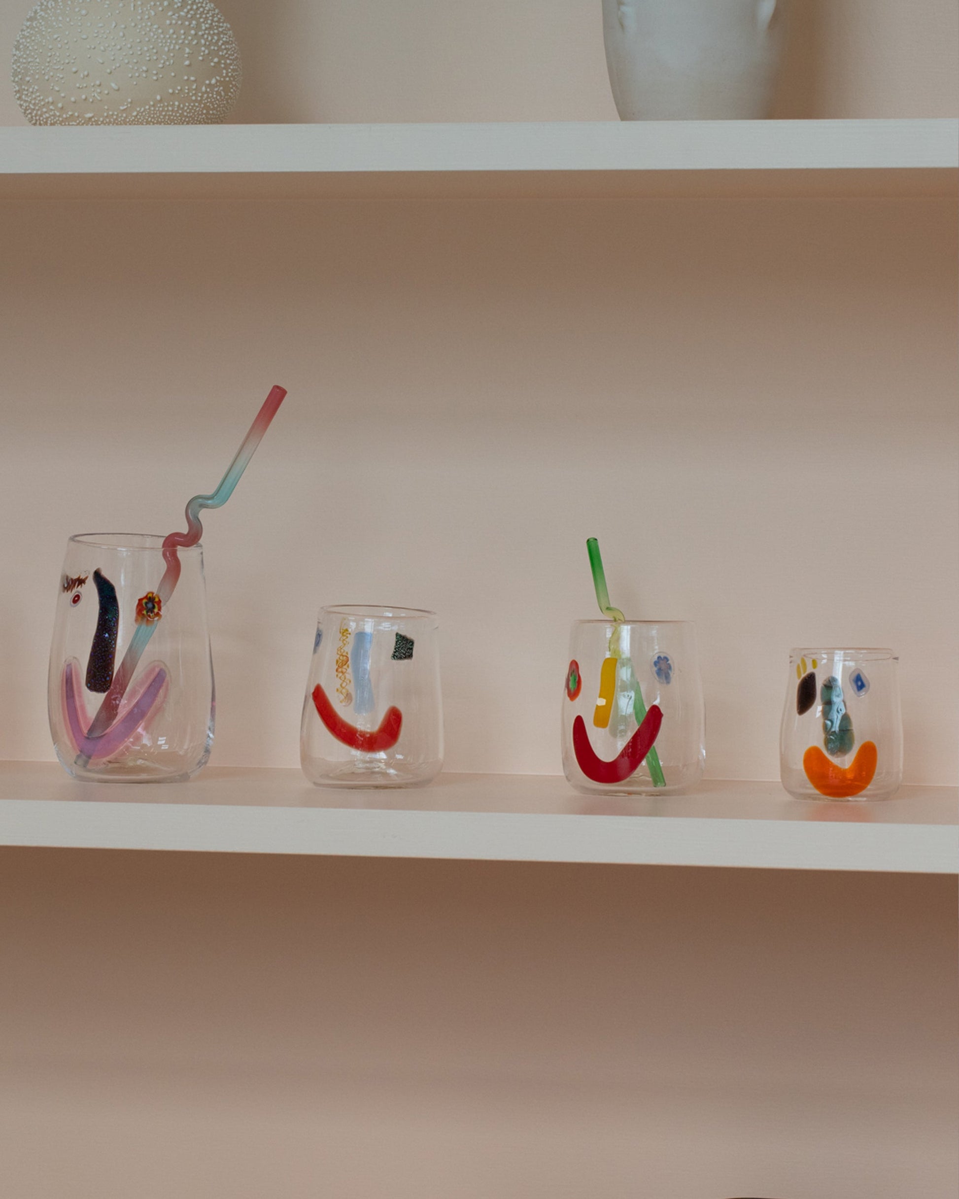 Group of FACEVESSEL Face Glasses on light color background.