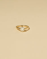 Cushion Modified Brilliant Diamond Solitaire Ring on light color background.