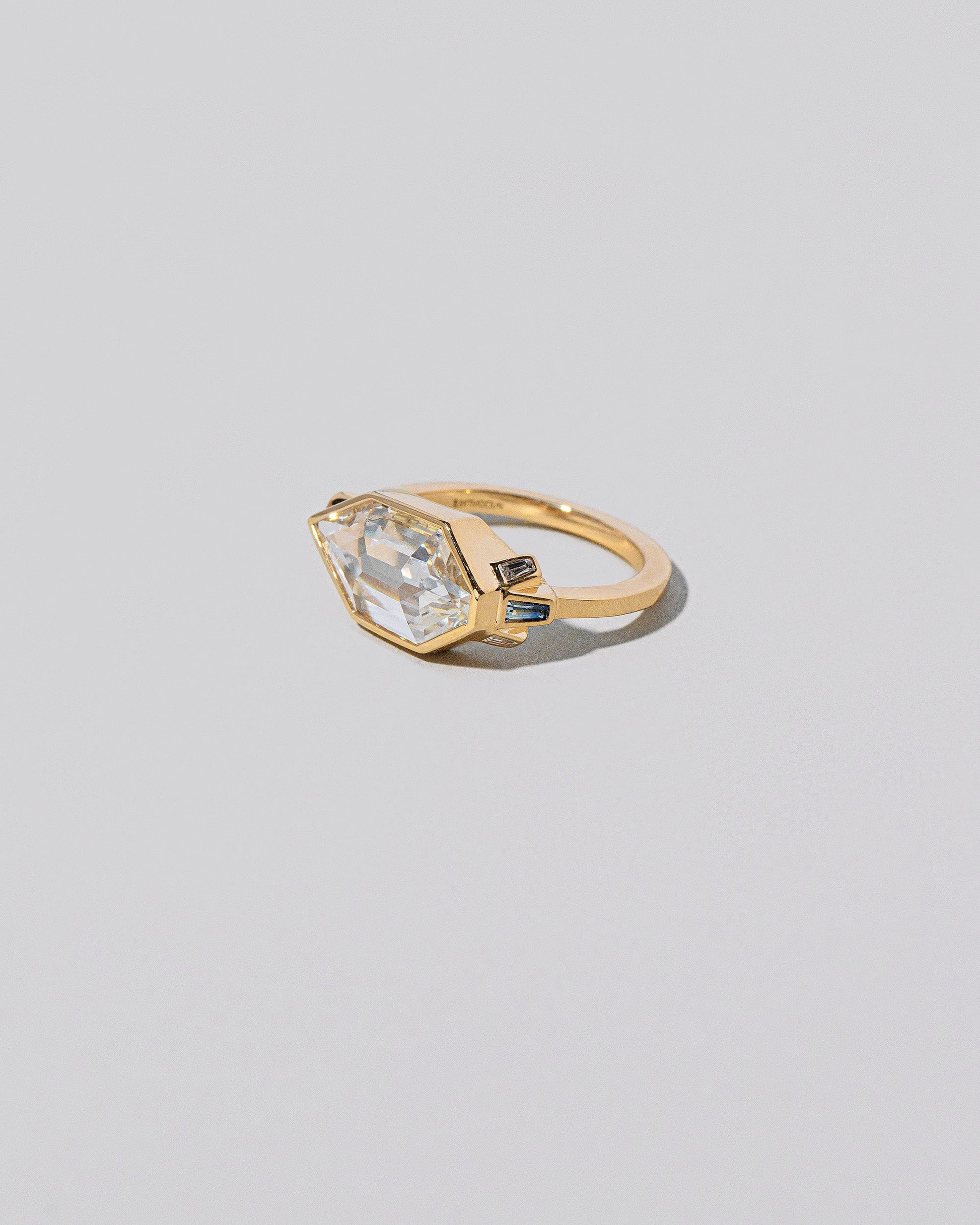  Okama Ring on light color background.