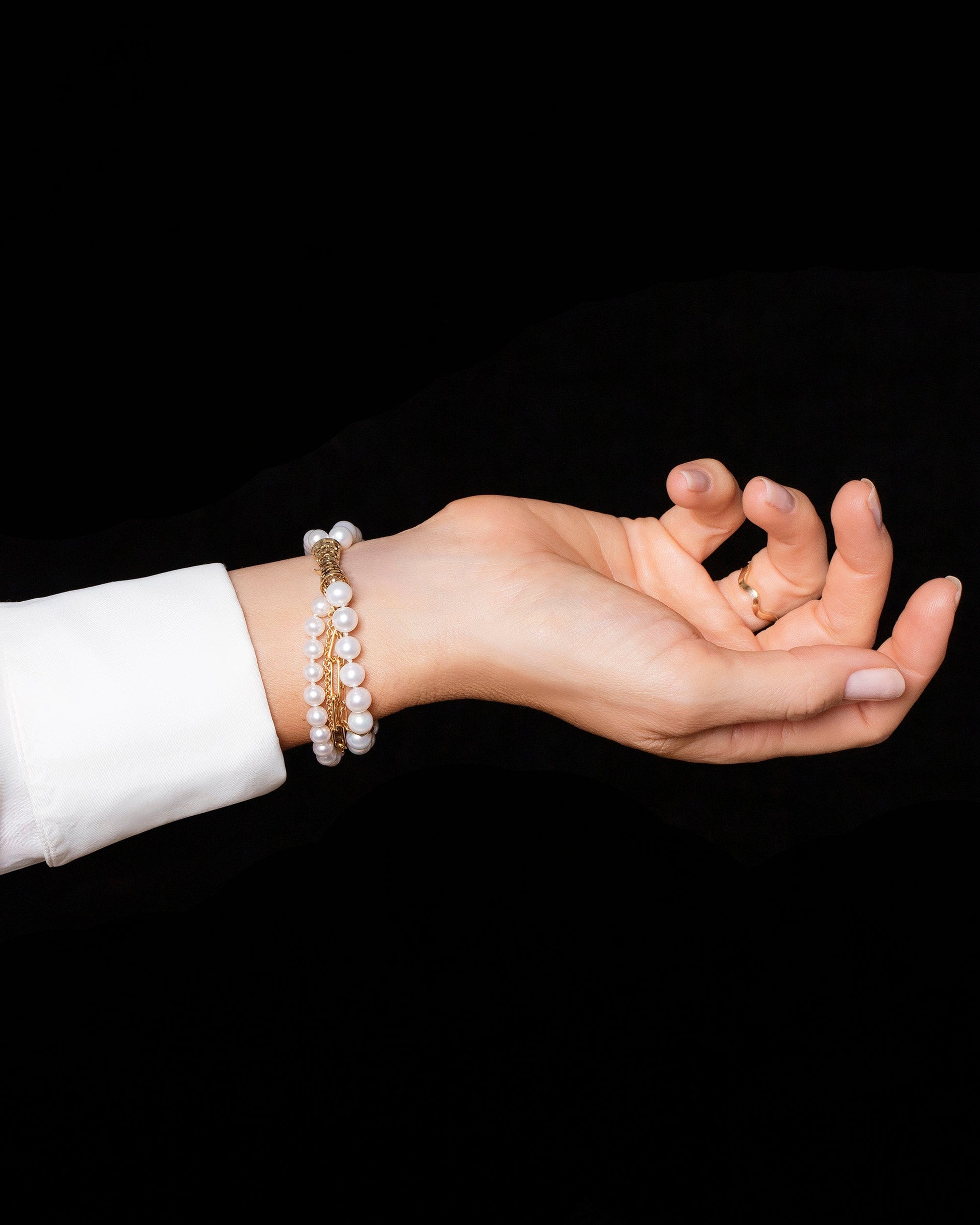 Layered Pearl Bracelet on model.