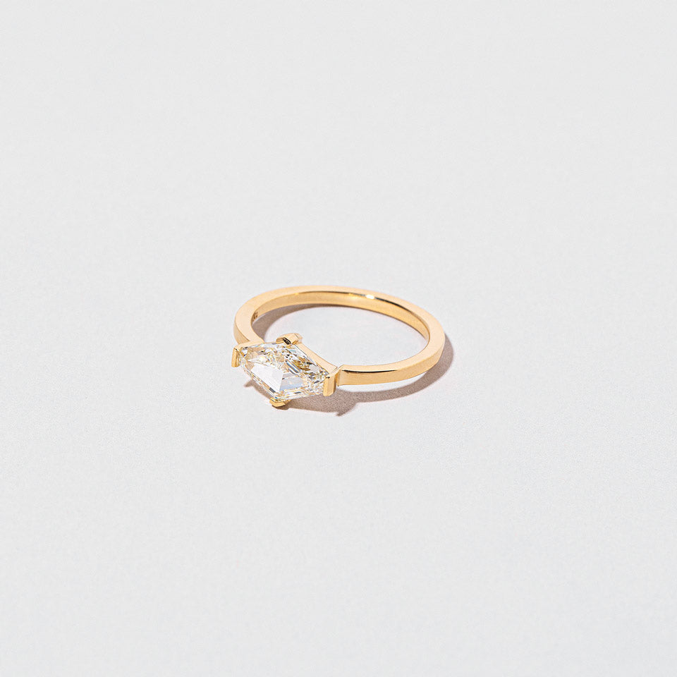 product_details::Closeup details of the Divine Geometry Ring on light color background.