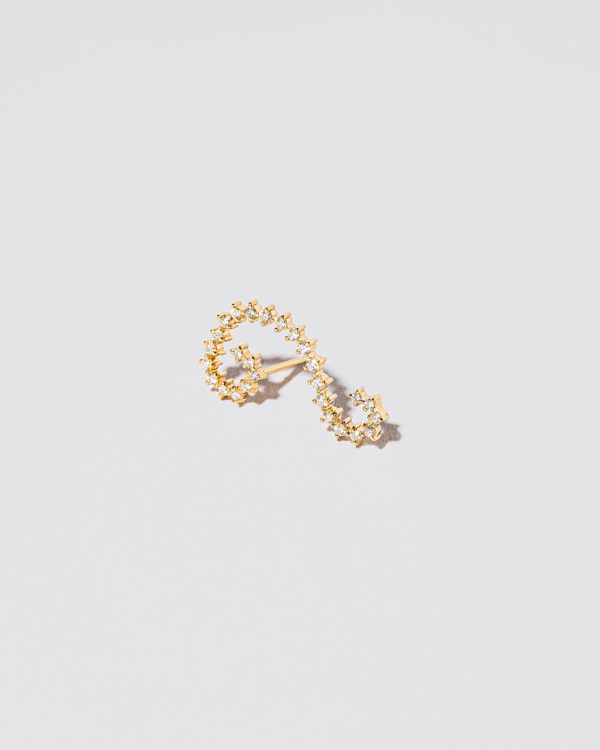Left White Diamond Symbol of Change Earring Single on light color background.