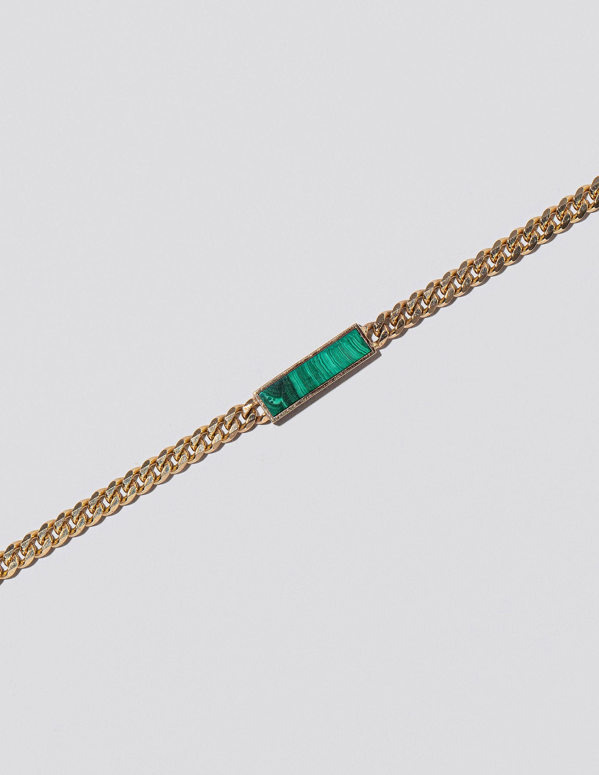 Identity Chain Necklace on light colored background.