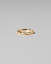 Gold Etched Infinity Pattern Band on light color background.