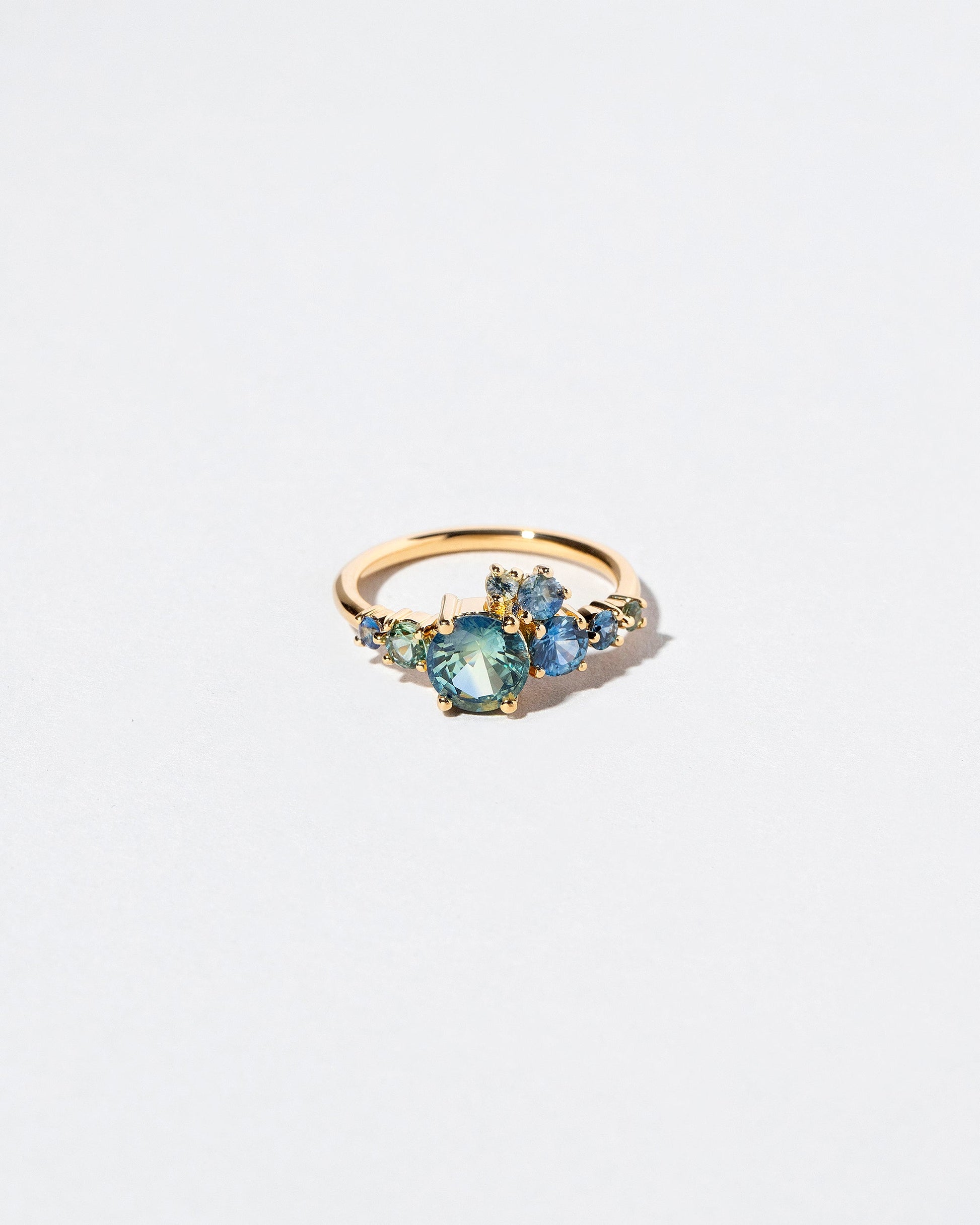 Luna Ring - Bicolor Sapphire on light color background.