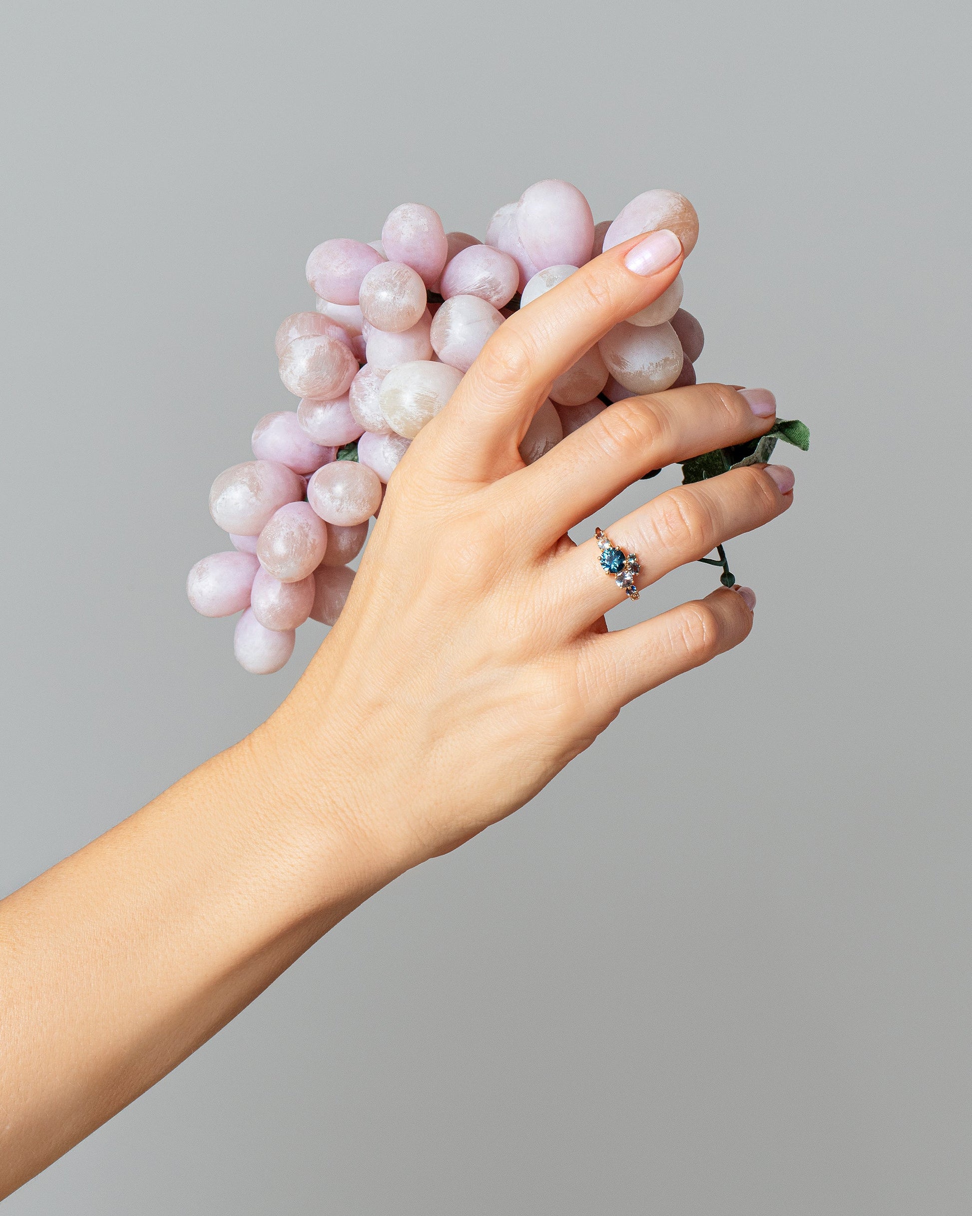 Luna Ring - Blue Sapphire on light color background.
