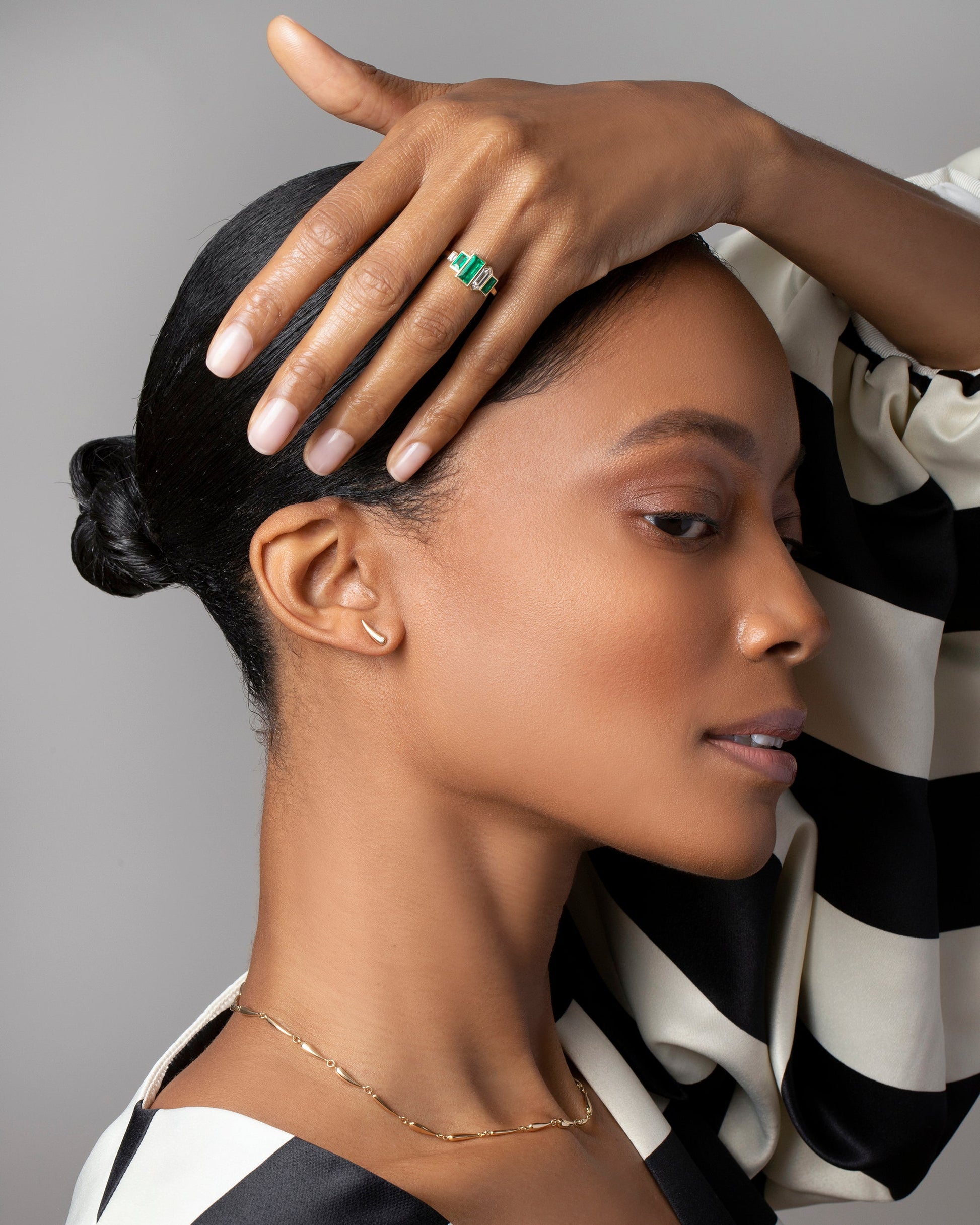 Memling Dawn Ring, Right Solid One & Others Stud Earring Single and Accumulation Necklace on model.