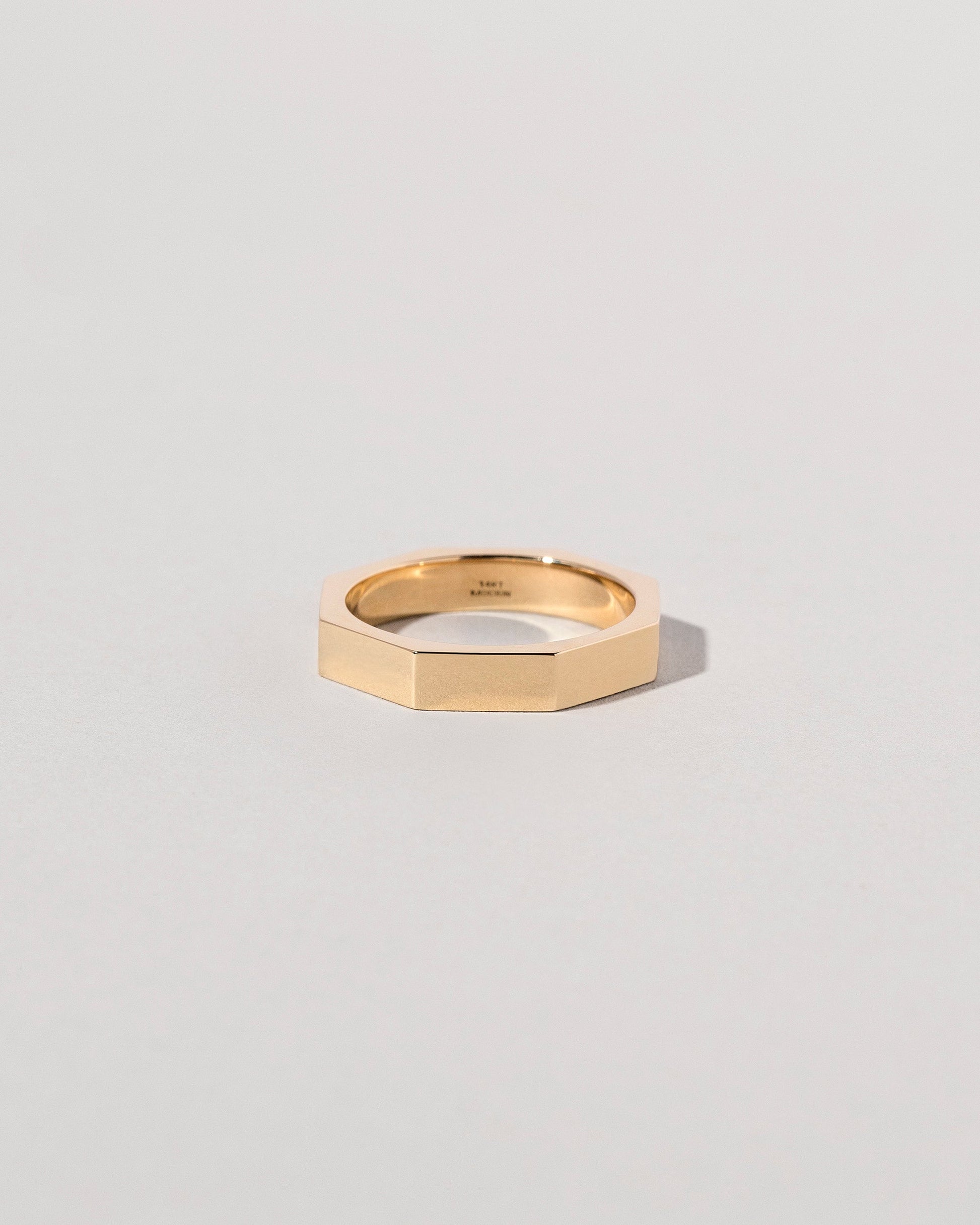 Gold 4mm Segmented Band on light color background.