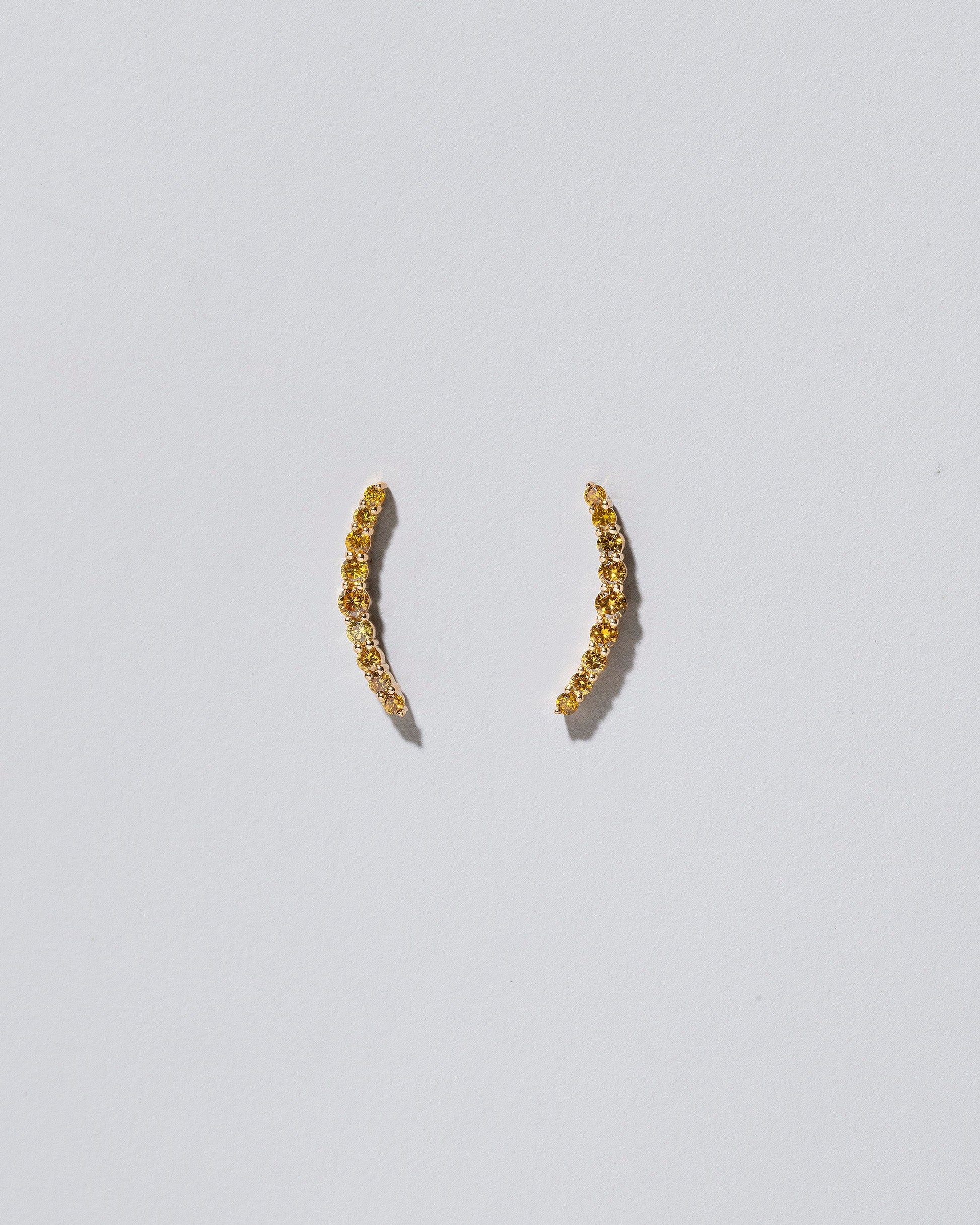 Crescent Ear Climber Stud Earrings - Yellow Diamond on light color background.