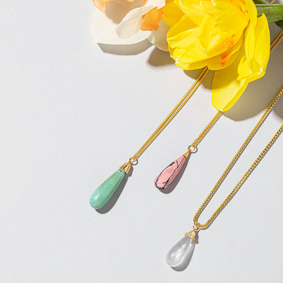 product_details::Turquoise Drop Pendant on light color background.