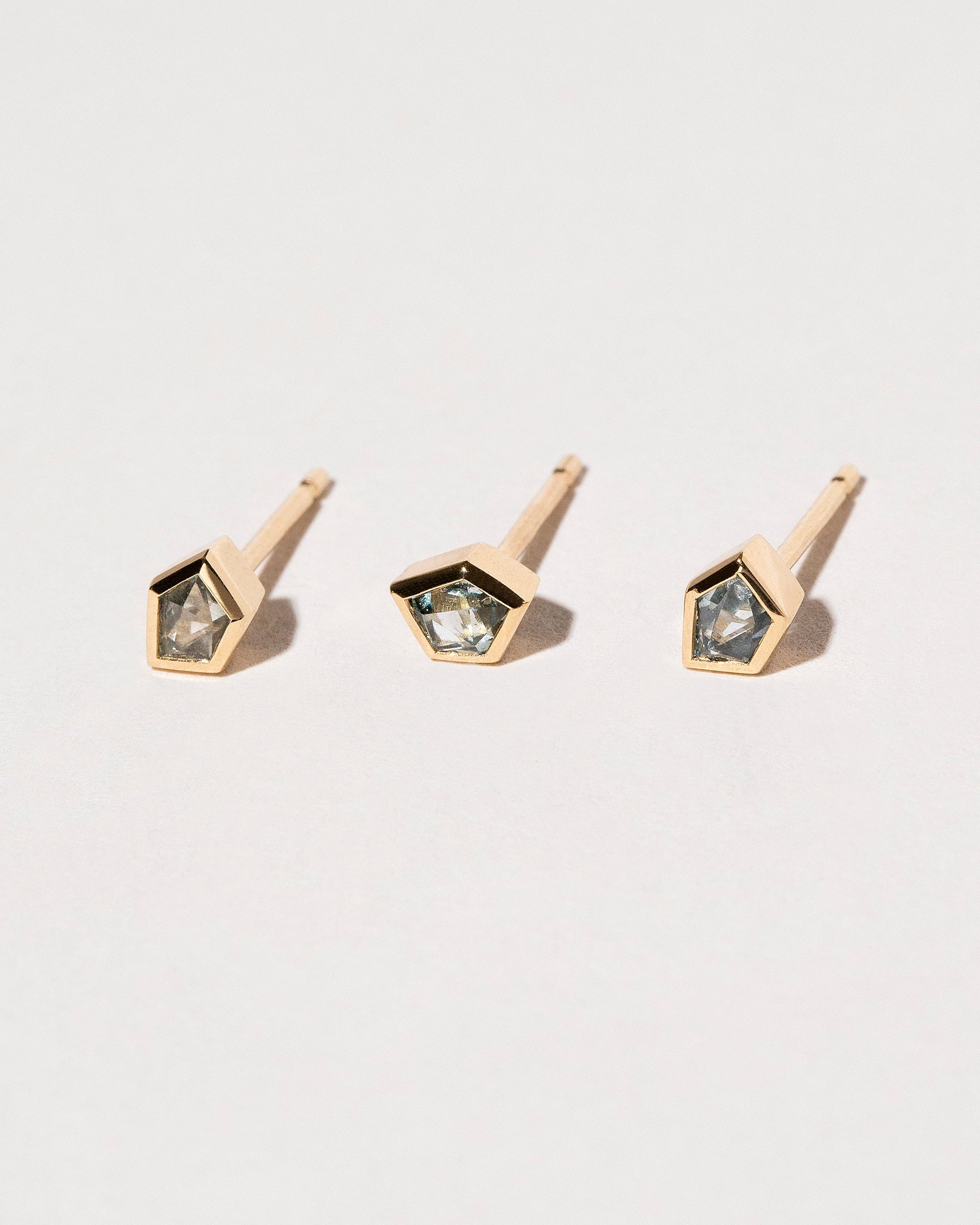  Geo Sapphire Single Stud on light color background.