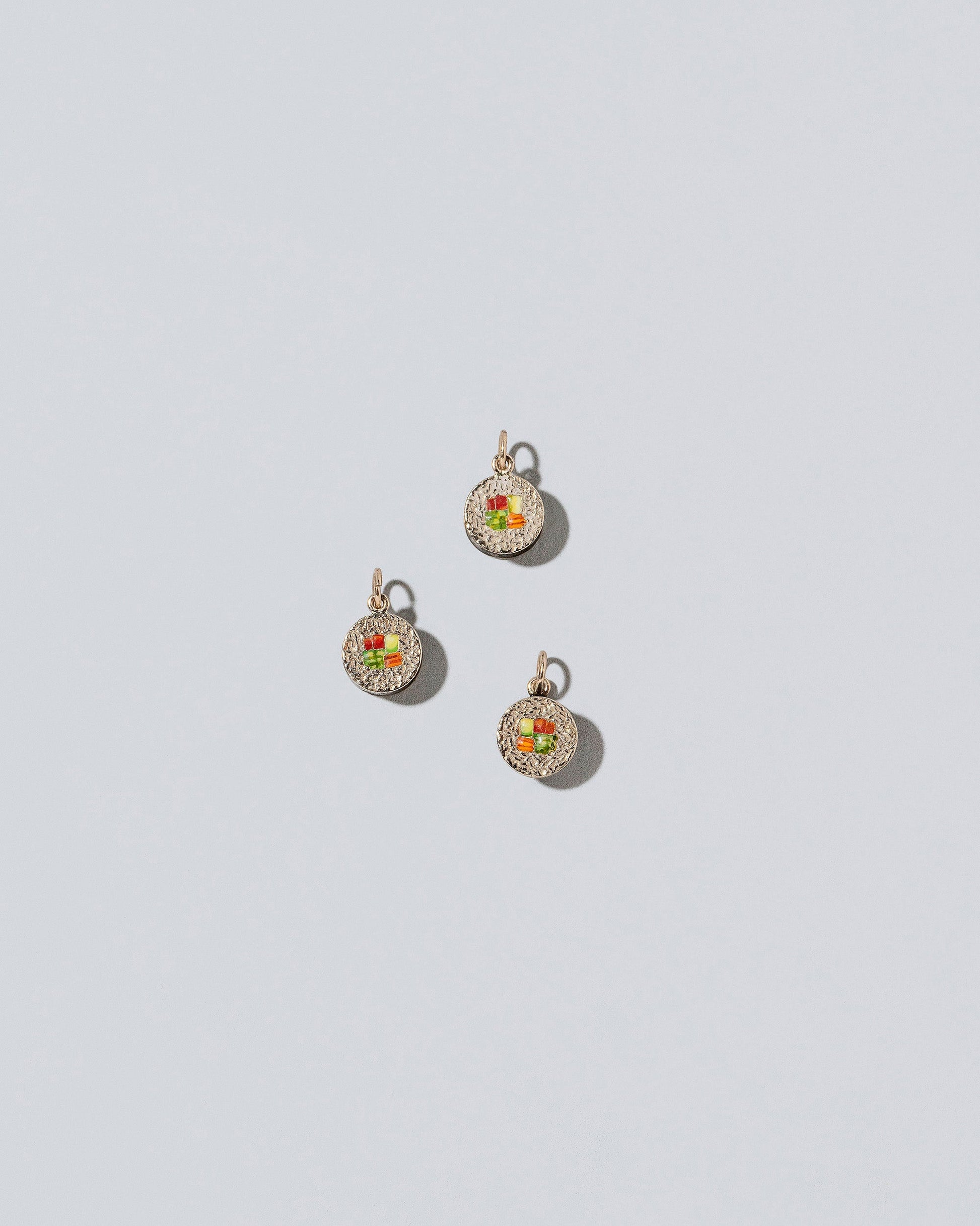 Sushi Charms on light color background.