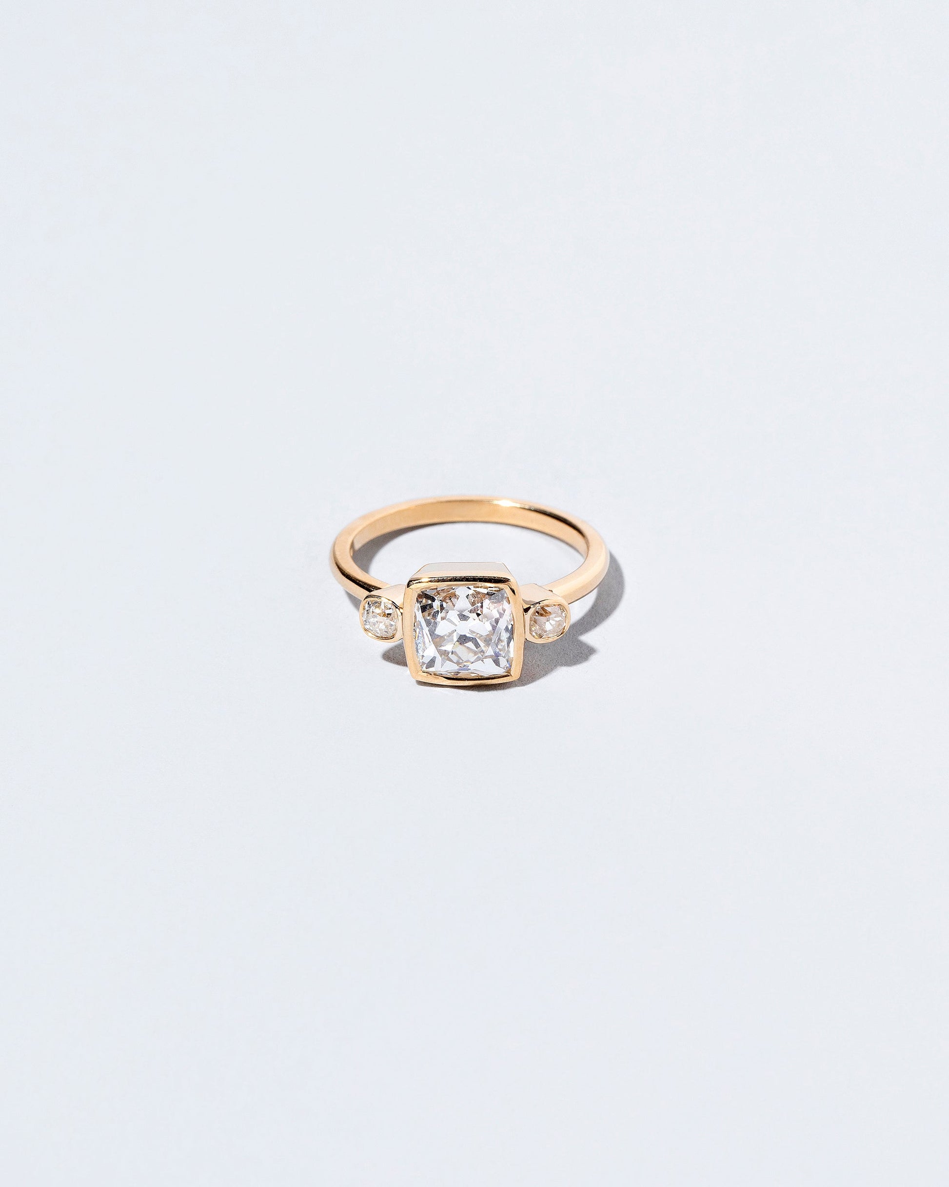  Genesis Ring on light color background.