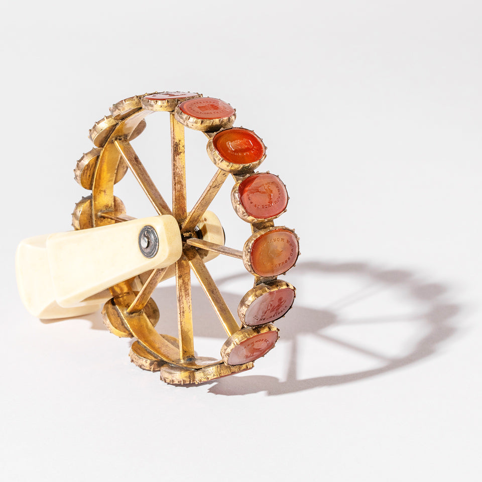 product_details::Styled image featuring an antique rotating wheel containing 16 doublets.