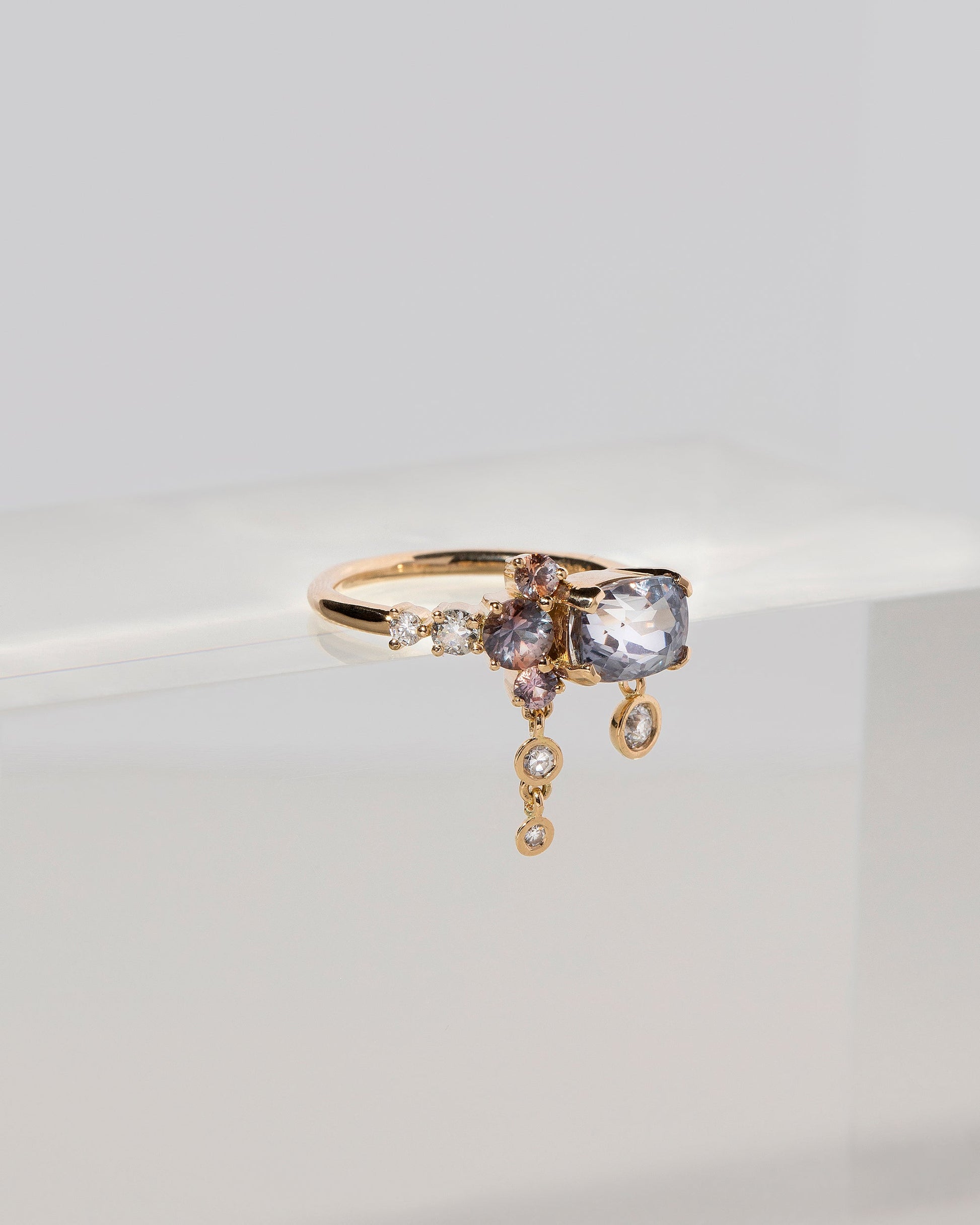  Nivithigala Sapphire Cluster Ring on light color background.