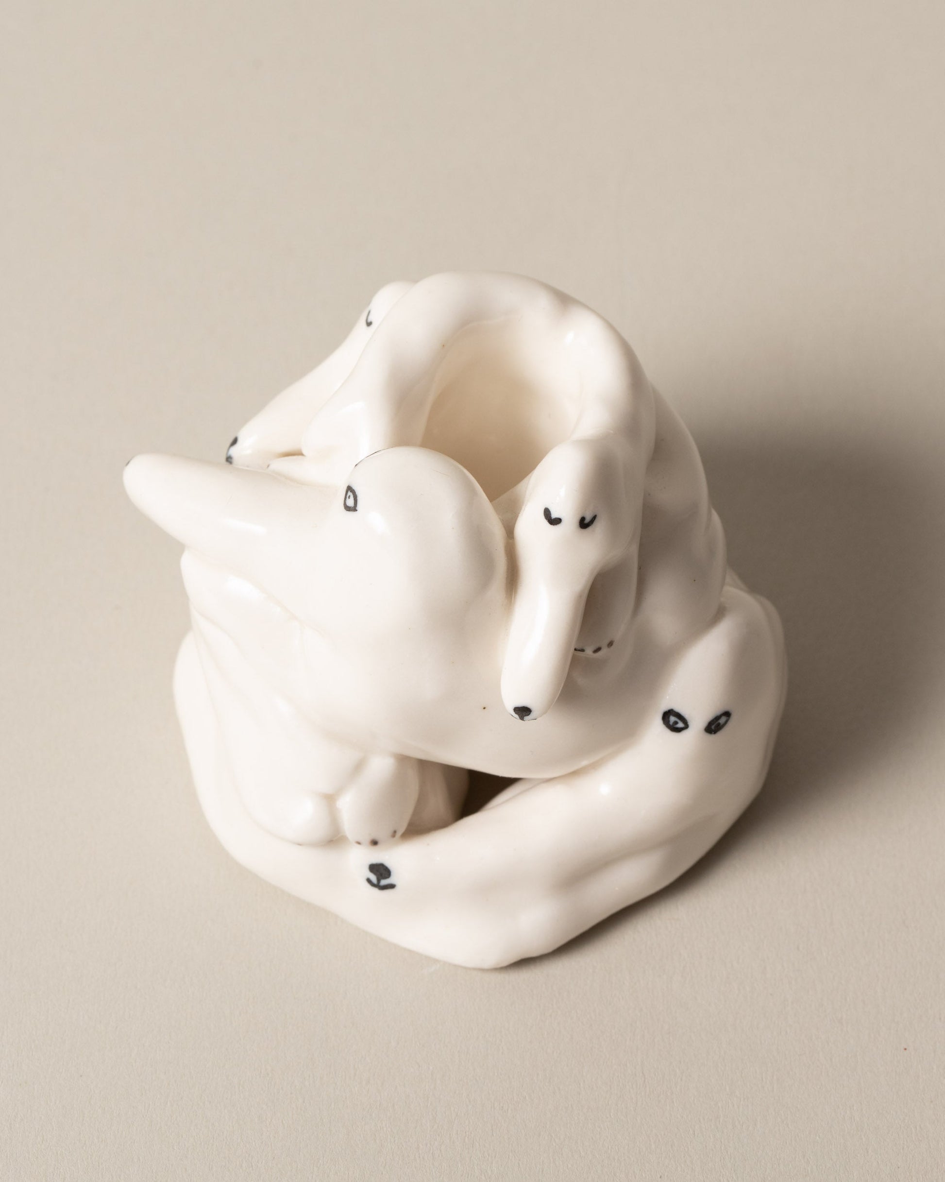 Closeup detail of the Eleonor Boström White Dog Pile on light color background.