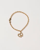 Salted Pretzel Charm Bracelet on light color background.